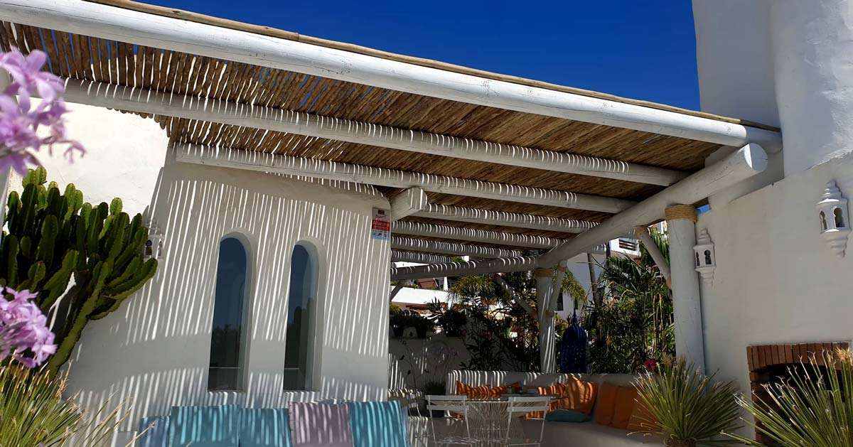 Cape Reed white-wash semi-shaded pergola with timber laths