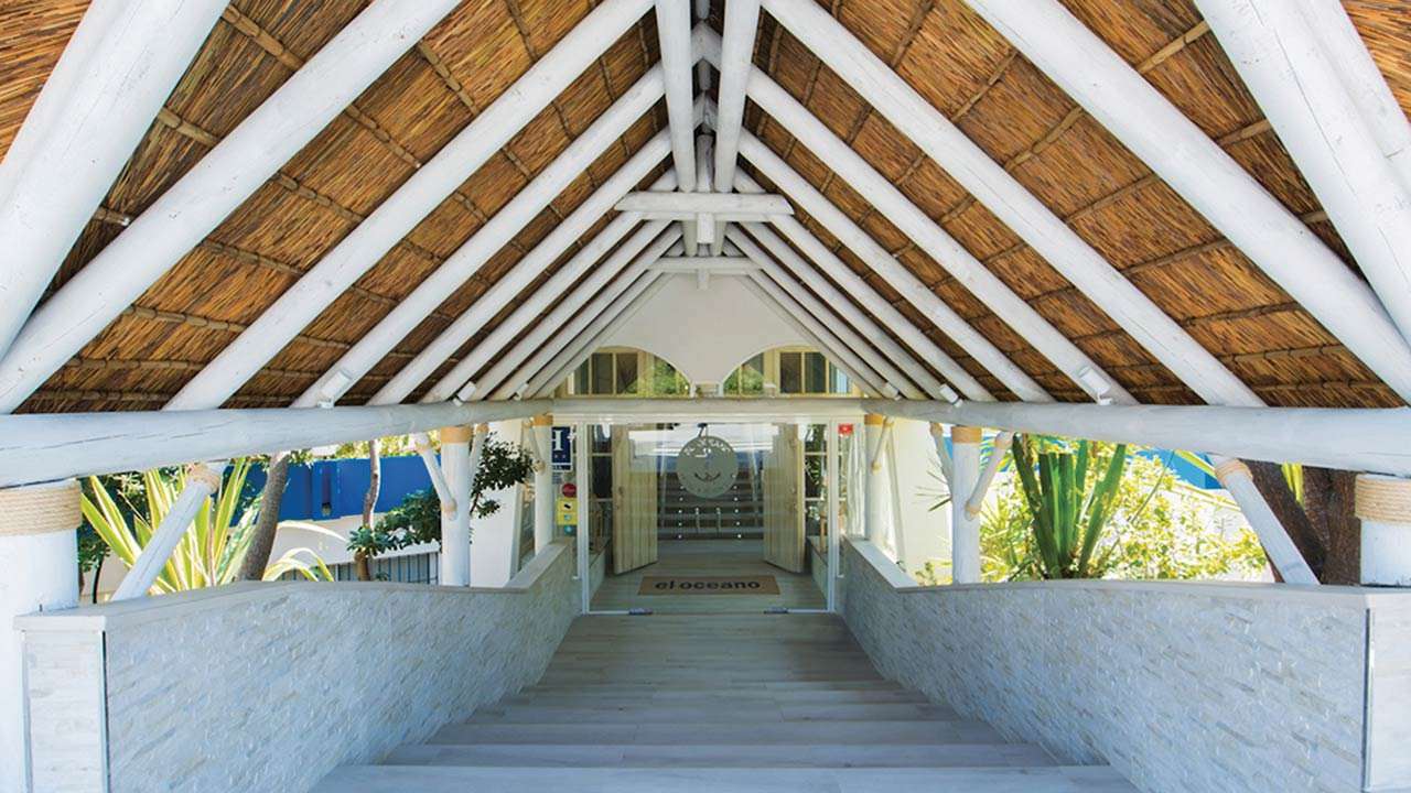 El Oceano beach restaurant white washed thatched roof entrance